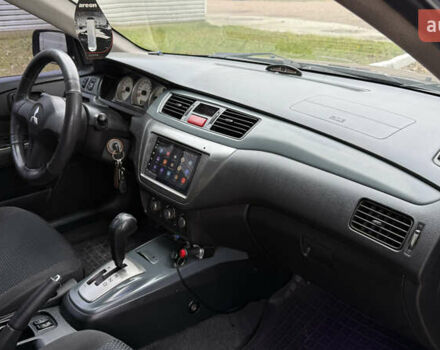 Чорний Міцубісі Lancer, об'ємом двигуна 1.58 л та пробігом 386 тис. км за 4450 $, фото 21 на Automoto.ua