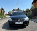 Чорний Міцубісі Lancer, об'ємом двигуна 1.58 л та пробігом 265 тис. км за 5100 $, фото 1 на Automoto.ua