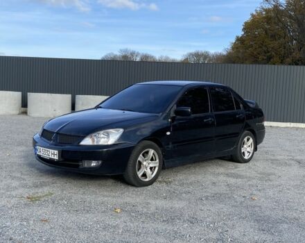 Черный Мицубиси Лансер, объемом двигателя 1.6 л и пробегом 200 тыс. км за 3400 $, фото 1 на Automoto.ua