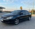 Чорний Міцубісі Lancer, об'ємом двигуна 2 л та пробігом 290 тис. км за 4700 $, фото 1 на Automoto.ua