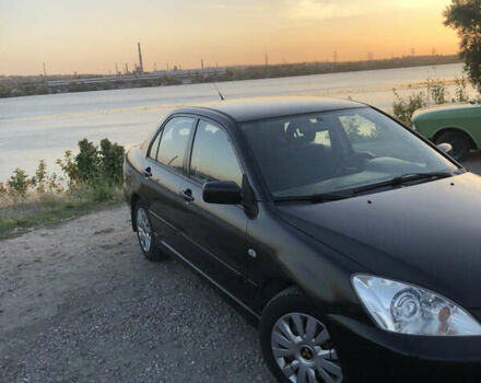 Черный Мицубиси Лансер, объемом двигателя 1.58 л и пробегом 161 тыс. км за 4800 $, фото 6 на Automoto.ua