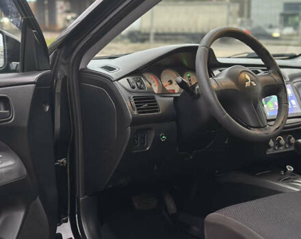 Чорний Міцубісі Lancer, об'ємом двигуна 1.58 л та пробігом 230 тис. км за 4350 $, фото 12 на Automoto.ua