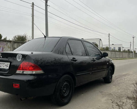 Чорний Міцубісі Lancer, об'ємом двигуна 1.58 л та пробігом 230 тис. км за 3350 $, фото 4 на Automoto.ua