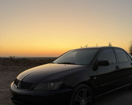 Чорний Міцубісі Lancer, об'ємом двигуна 2 л та пробігом 300 тис. км за 4100 $, фото 1 на Automoto.ua