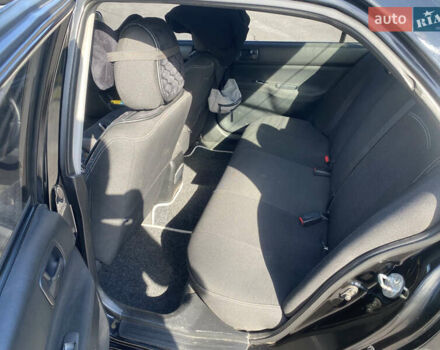 Чорний Міцубісі Lancer, об'ємом двигуна 1.58 л та пробігом 236 тис. км за 4500 $, фото 7 на Automoto.ua