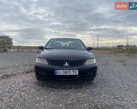 Чорний Міцубісі Lancer, об'ємом двигуна 1.6 л та пробігом 335 тис. км за 3500 $, фото 1 на Automoto.ua