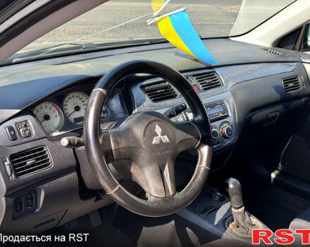 Черный Мицубиси Лансер, объемом двигателя 1.6 л и пробегом 300 тыс. км за 3599 $, фото 9 на Automoto.ua