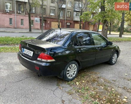 Черный Мицубиси Лансер, объемом двигателя 1.59 л и пробегом 286 тыс. км за 3700 $, фото 3 на Automoto.ua