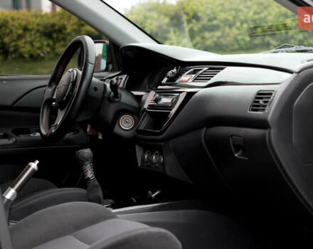 Черный Мицубиси Лансер, объемом двигателя 2 л и пробегом 253 тыс. км за 6900 $, фото 7 на Automoto.ua