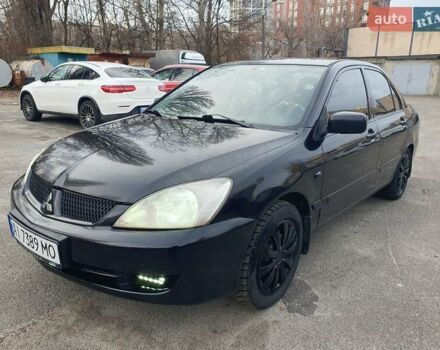 Черный Мицубиси Лансер, объемом двигателя 1.58 л и пробегом 222 тыс. км за 2999 $, фото 1 на Automoto.ua