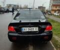 Черный Мицубиси Лансер, объемом двигателя 1.58 л и пробегом 270 тыс. км за 4000 $, фото 3 на Automoto.ua