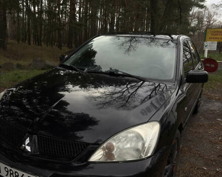 Чорний Міцубісі Lancer, об'ємом двигуна 1.58 л та пробігом 210 тис. км за 3900 $, фото 9 на Automoto.ua