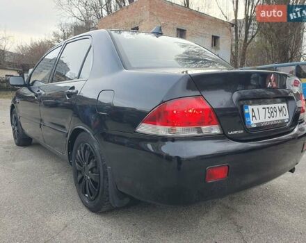 Черный Мицубиси Лансер, объемом двигателя 1.58 л и пробегом 222 тыс. км за 2999 $, фото 11 на Automoto.ua