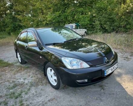 Черный Мицубиси Лансер, объемом двигателя 1.6 л и пробегом 289 тыс. км за 3200 $, фото 4 на Automoto.ua