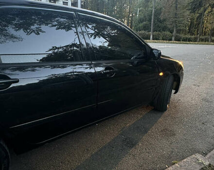 Черный Мицубиси Лансер, объемом двигателя 1.6 л и пробегом 233 тыс. км за 3650 $, фото 6 на Automoto.ua