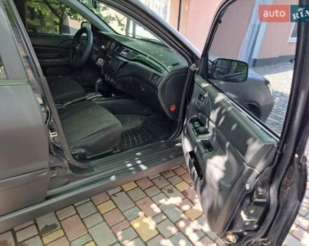 Чорний Міцубісі Lancer, об'ємом двигуна 1.58 л та пробігом 280 тис. км за 3950 $, фото 19 на Automoto.ua
