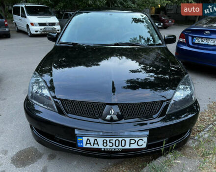 Черный Мицубиси Лансер, объемом двигателя 2 л и пробегом 255 тыс. км за 5000 $, фото 5 на Automoto.ua