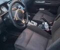 Черный Мицубиси Лансер, объемом двигателя 2 л и пробегом 238 тыс. км за 6000 $, фото 7 на Automoto.ua