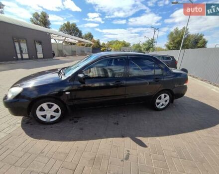 Черный Мицубиси Лансер, объемом двигателя 1.58 л и пробегом 128 тыс. км за 4600 $, фото 22 на Automoto.ua