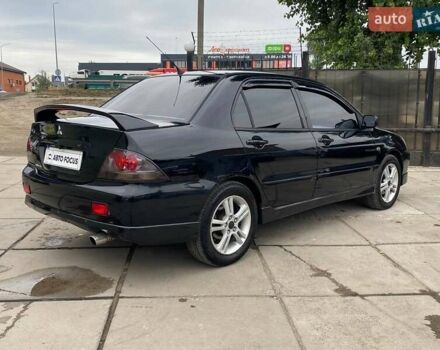 Чорний Міцубісі Lancer, об'ємом двигуна 2 л та пробігом 248 тис. км за 4990 $, фото 6 на Automoto.ua