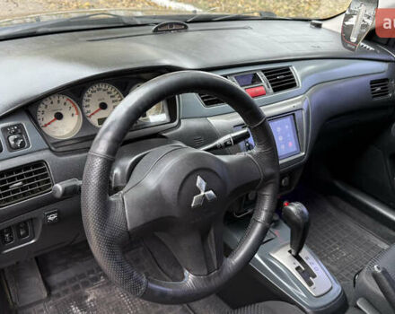 Чорний Міцубісі Lancer, об'ємом двигуна 1.58 л та пробігом 386 тис. км за 4450 $, фото 12 на Automoto.ua