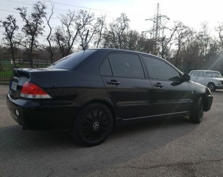 Черный Мицубиси Лансер, объемом двигателя 1.6 л и пробегом 290 тыс. км за 3200 $, фото 4 на Automoto.ua