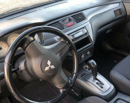 Черный Мицубиси Лансер, объемом двигателя 1.58 л и пробегом 161 тыс. км за 4800 $, фото 7 на Automoto.ua