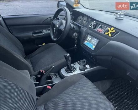 Чорний Міцубісі Lancer, об'ємом двигуна 1.58 л та пробігом 282 тис. км за 4100 $, фото 9 на Automoto.ua