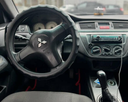 Черный Мицубиси Лансер, объемом двигателя 1.58 л и пробегом 370 тыс. км за 3500 $, фото 8 на Automoto.ua