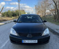 Чорний Міцубісі Lancer, об'ємом двигуна 1.58 л та пробігом 229 тис. км за 3700 $, фото 1 на Automoto.ua