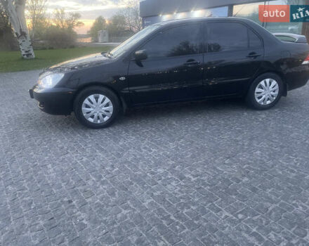 Черный Мицубиси Лансер, объемом двигателя 1.6 л и пробегом 231 тыс. км за 4250 $, фото 3 на Automoto.ua