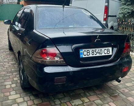Чорний Міцубісі Lancer, об'ємом двигуна 1.59 л та пробігом 305 тис. км за 2950 $, фото 2 на Automoto.ua