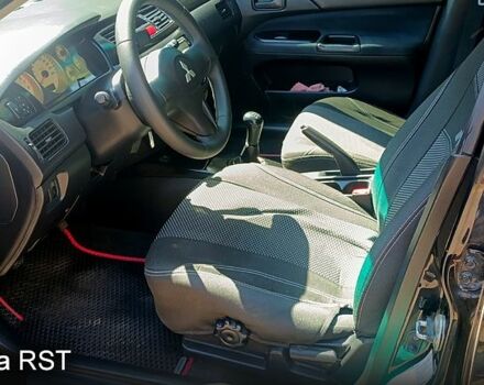 Черный Мицубиси Лансер, объемом двигателя 1.6 л и пробегом 238 тыс. км за 4300 $, фото 5 на Automoto.ua