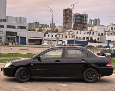 Чорний Міцубісі Lancer, об'ємом двигуна 1.58 л та пробігом 230 тис. км за 4350 $, фото 1 на Automoto.ua