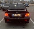 Черный Мицубиси Лансер, объемом двигателя 2 л и пробегом 238 тыс. км за 6000 $, фото 4 на Automoto.ua