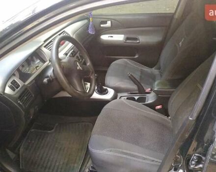 Черный Мицубиси Лансер, объемом двигателя 1.6 л и пробегом 257 тыс. км за 4500 $, фото 14 на Automoto.ua