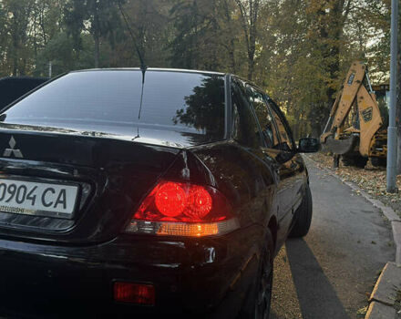 Черный Мицубиси Лансер, объемом двигателя 1.6 л и пробегом 233 тыс. км за 3650 $, фото 4 на Automoto.ua