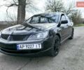 Черный Мицубиси Лансер, объемом двигателя 2 л и пробегом 209 тыс. км за 6800 $, фото 1 на Automoto.ua