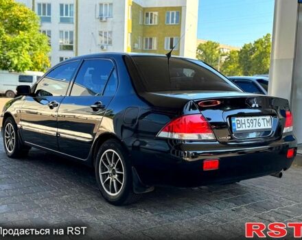 Чорний Міцубісі Lancer, об'ємом двигуна 1.6 л та пробігом 176 тис. км за 3777 $, фото 4 на Automoto.ua