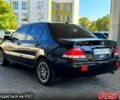Чорний Міцубісі Lancer, об'ємом двигуна 1.6 л та пробігом 176 тис. км за 3777 $, фото 4 на Automoto.ua