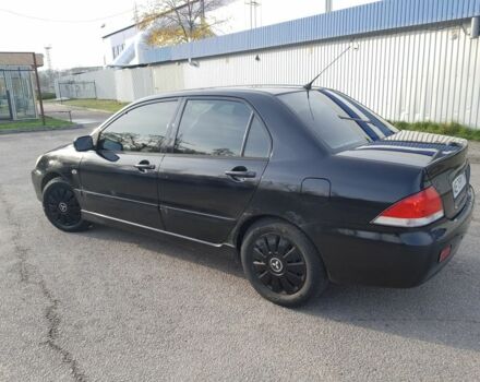 Черный Мицубиси Лансер, объемом двигателя 1.6 л и пробегом 290 тыс. км за 3200 $, фото 2 на Automoto.ua