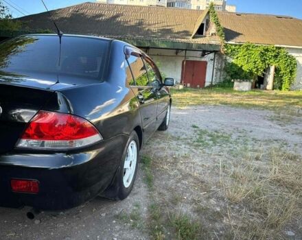 Черный Мицубиси Лансер, объемом двигателя 1.6 л и пробегом 289 тыс. км за 3200 $, фото 3 на Automoto.ua