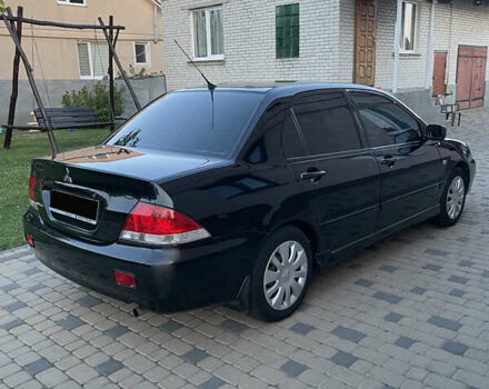 Чорний Міцубісі Lancer, об'ємом двигуна 1.6 л та пробігом 170 тис. км за 4900 $, фото 3 на Automoto.ua