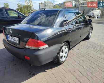 Черный Мицубиси Лансер, объемом двигателя 1.58 л и пробегом 128 тыс. км за 4600 $, фото 6 на Automoto.ua