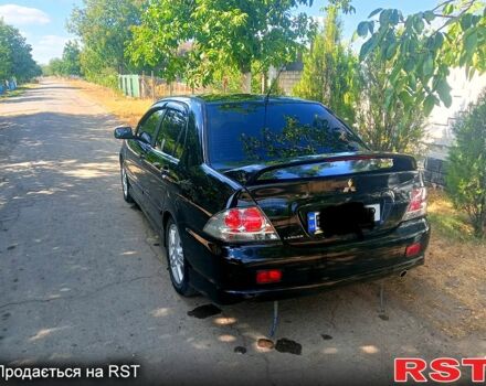 Чорний Міцубісі Lancer, об'ємом двигуна 2 л та пробігом 173 тис. км за 5200 $, фото 1 на Automoto.ua