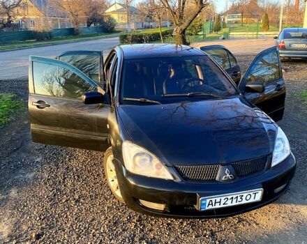 Чорний Міцубісі Lancer, об'ємом двигуна 1.6 л та пробігом 330 тис. км за 4500 $, фото 1 на Automoto.ua