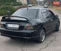 Чорний Міцубісі Lancer, об'ємом двигуна 2 л та пробігом 242 тис. км за 5900 $, фото 3 на Automoto.ua