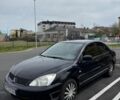 Чорний Міцубісі Lancer, об'ємом двигуна 1.58 л та пробігом 132 тис. км за 4650 $, фото 1 на Automoto.ua