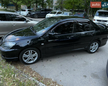 Черный Мицубиси Лансер, объемом двигателя 2 л и пробегом 255 тыс. км за 5000 $, фото 4 на Automoto.ua