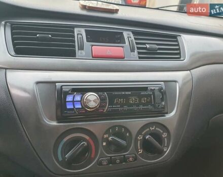 Черный Мицубиси Лансер, объемом двигателя 1.58 л и пробегом 222 тыс. км за 2999 $, фото 21 на Automoto.ua